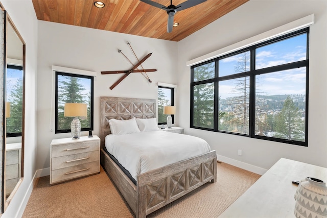 1148 Glades Dr, Whitefish, MT 59937 - bedroom with a towering ceiling, light colored carpet, ceiling fan, and wooden ceiling