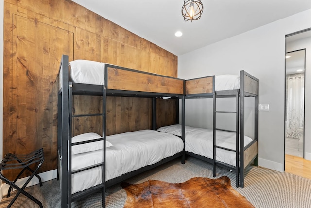 1148 Glades Dr, Whitefish, MT 59937 - bedroom with wood walls and carpet