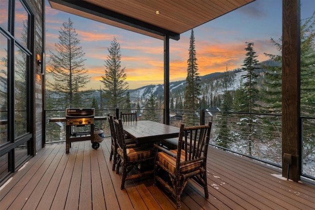 1148 Glades Dr, Whitefish, MT 59937 - deck at dusk featuring a mountain view