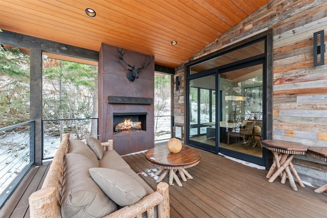 1148 Glades Dr, Whitefish, MT 59937 - sunroom / solarium with a fireplace, wooden ceiling, and vaulted ceiling