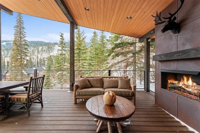 1148 Glades Dr, Whitefish, MT 59937 - wooden terrace featuring an outdoor living space with a fireplace