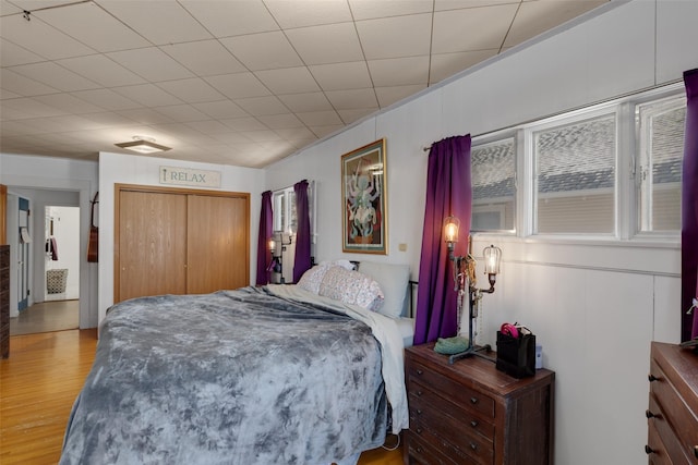 bedroom featuring a closet and light hardwood / wood-style flooring