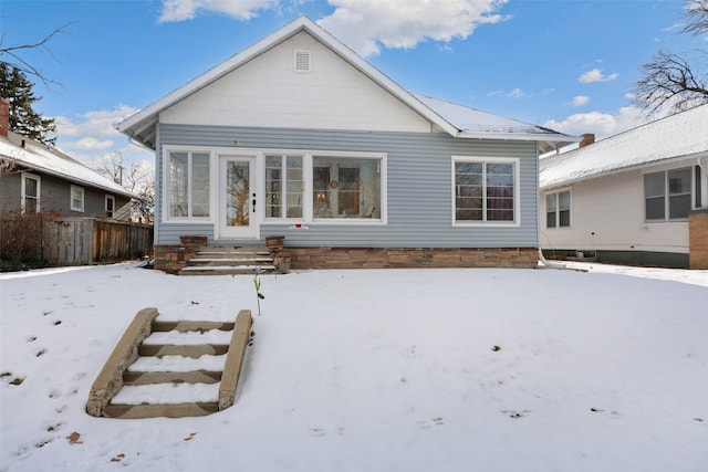 view of snow covered house