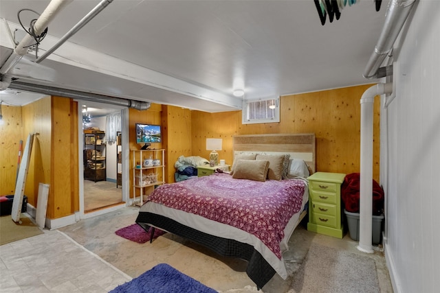 bedroom with wooden walls