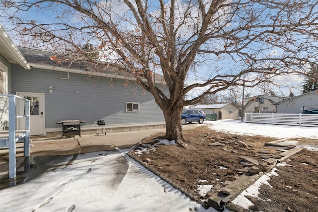 view of yard layered in snow