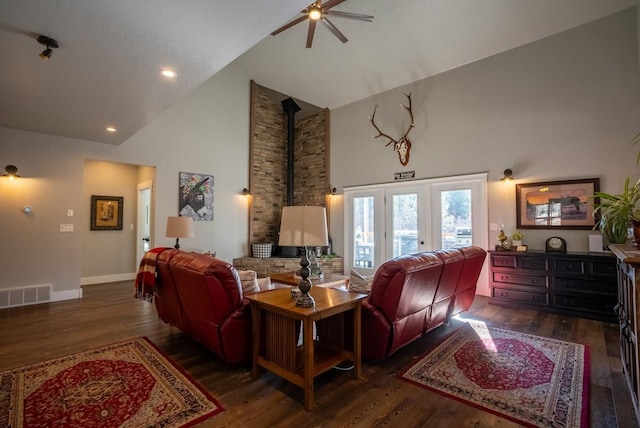 living room featuring ceiling fan, high vaulted ceiling, and dark hardwood / wood-style floors