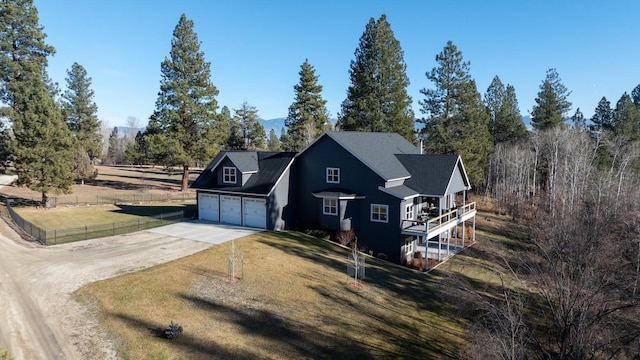 view of front facade featuring a garage and a front lawn