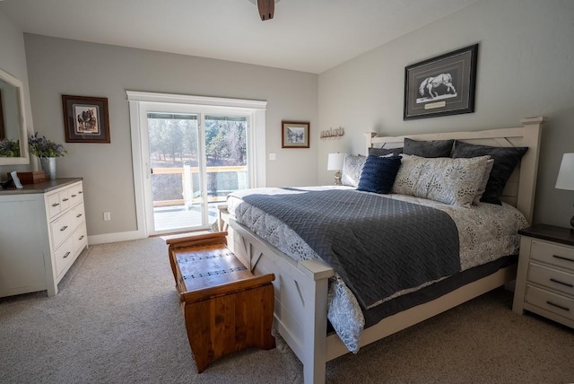 carpeted bedroom featuring ceiling fan and access to outside