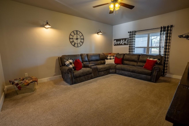 carpeted living room with ceiling fan