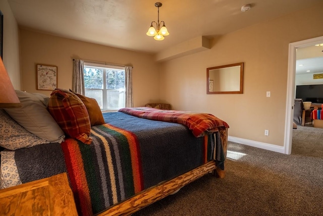 bedroom featuring carpet and a chandelier