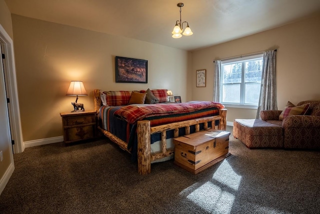 bedroom with a chandelier and dark colored carpet