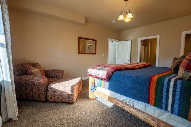 carpeted bedroom with an inviting chandelier