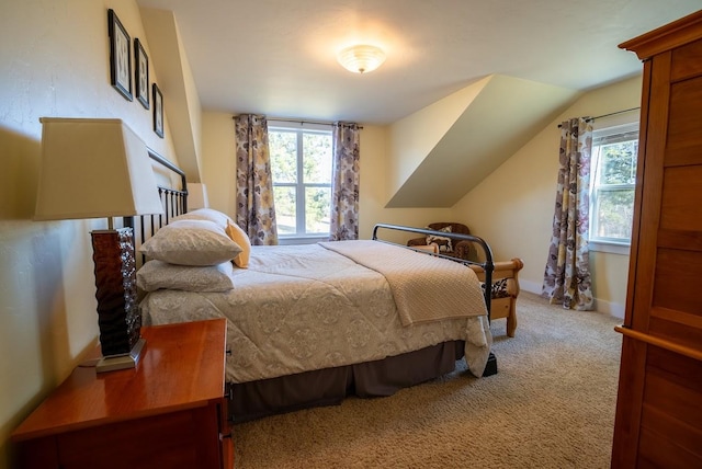 carpeted bedroom featuring multiple windows