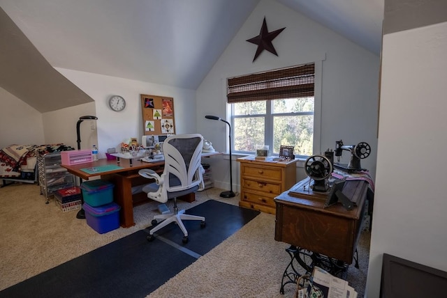 carpeted office space featuring lofted ceiling