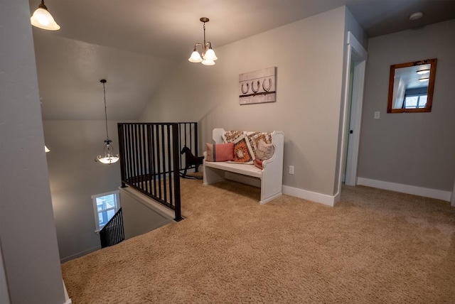 carpeted bedroom with an inviting chandelier and lofted ceiling