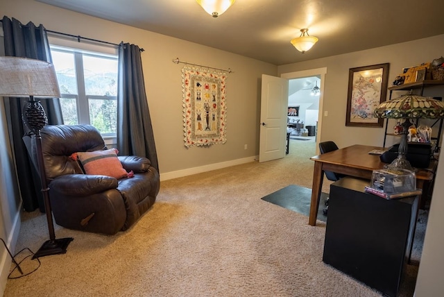 office area with ceiling fan and light carpet