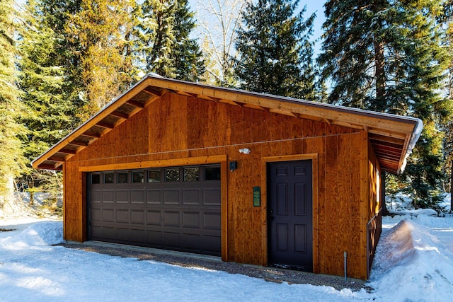 view of snow covered garage