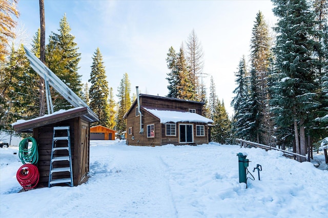 exterior space with a garage and an outdoor structure