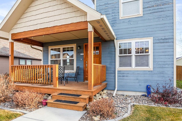 property entrance with covered porch