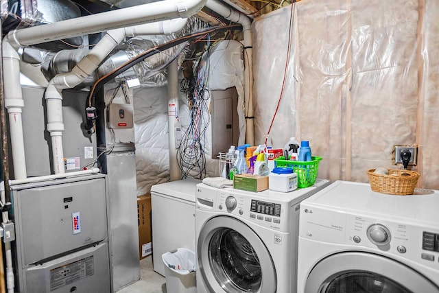 clothes washing area featuring washer and dryer