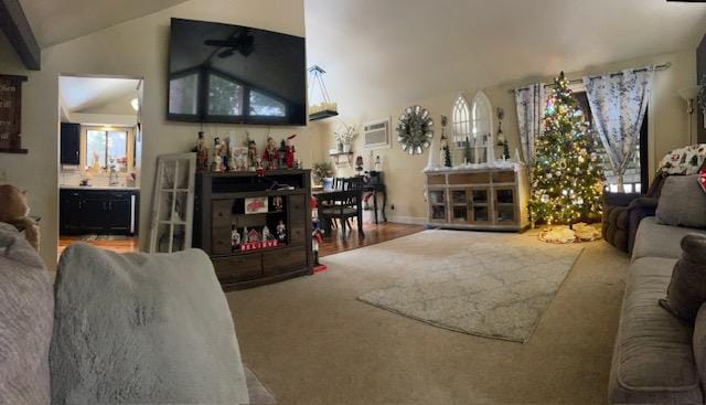 living room featuring ceiling fan and vaulted ceiling