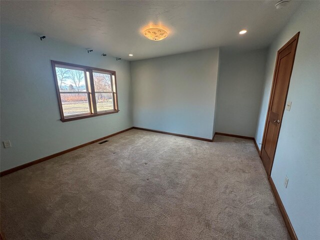 view of carpeted spare room