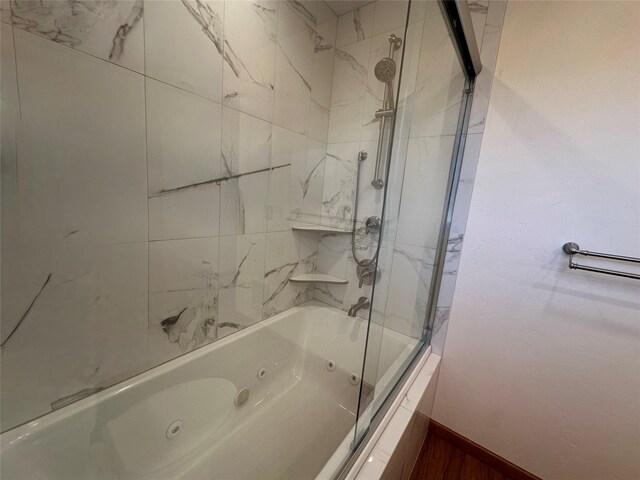 bathroom with tiled shower / bath combo