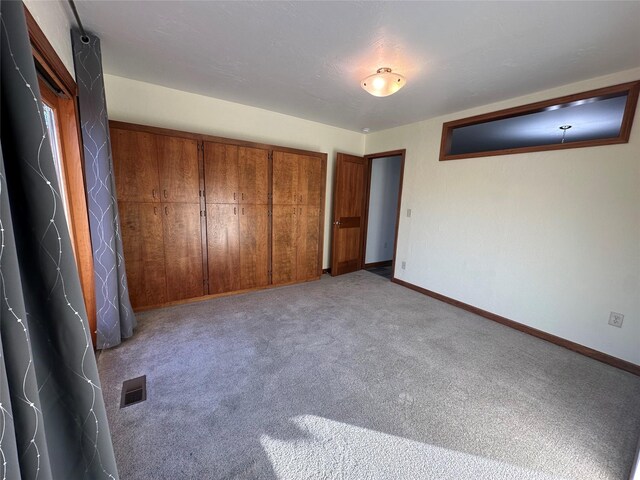 unfurnished bedroom with light carpet