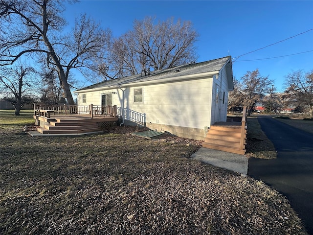 exterior space featuring a wooden deck