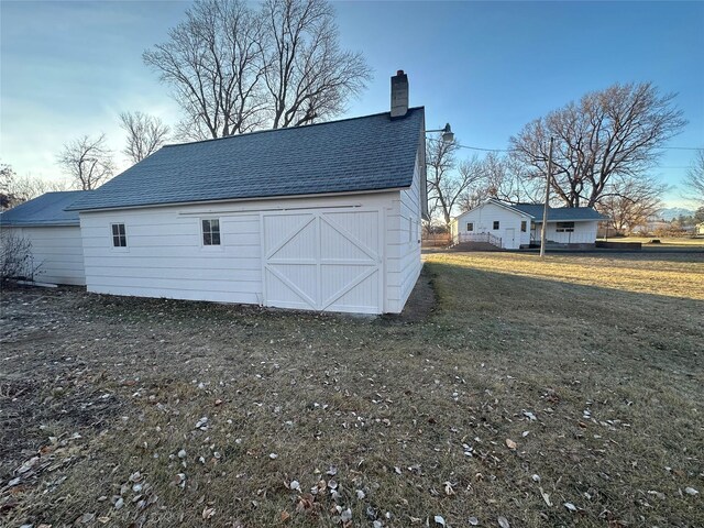 view of outdoor structure with a yard