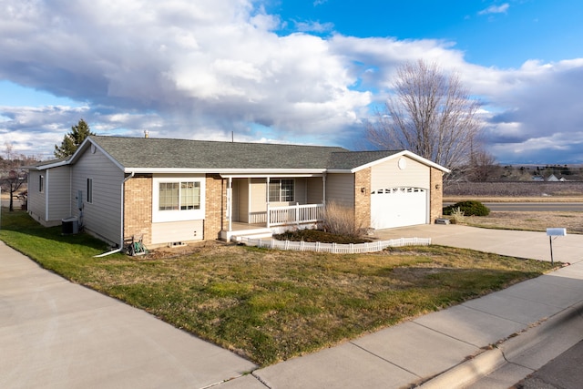 single story home with covered porch, a garage, central AC unit, and a front yard