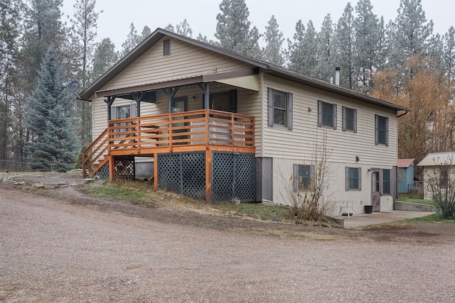 view of front of property featuring a wooden deck