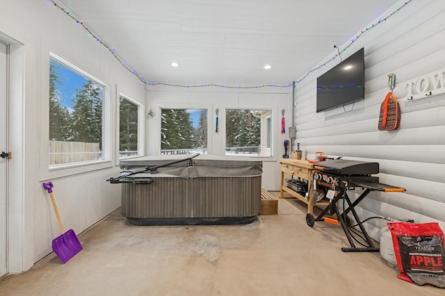 interior space featuring plenty of natural light and a hot tub