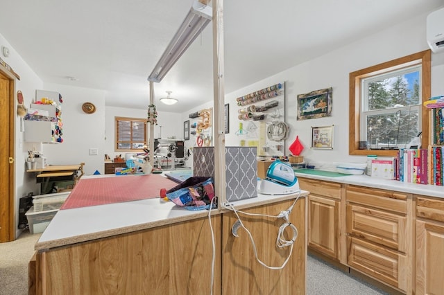 kitchen with light carpet and a wall unit AC