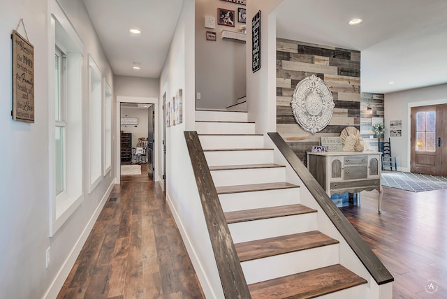 stairs featuring wood-type flooring