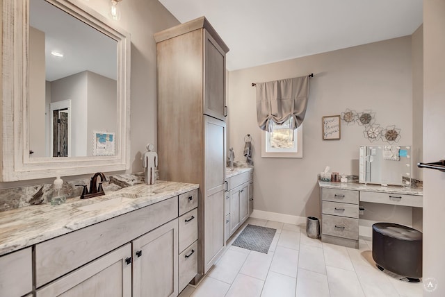 bathroom with tile patterned floors and vanity