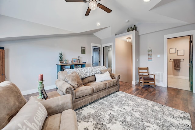 living room featuring dark hardwood / wood-style floors, ceiling fan, and vaulted ceiling