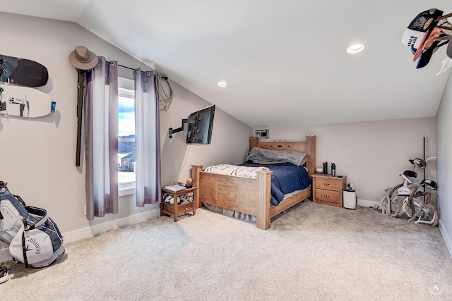 bedroom with light carpet and vaulted ceiling