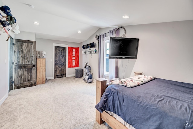 bedroom with carpet flooring and vaulted ceiling