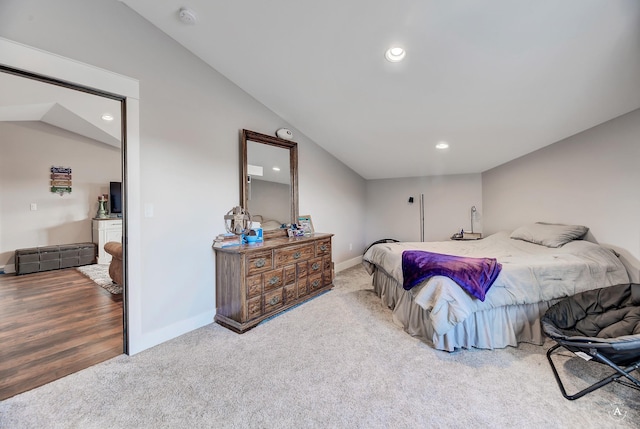 bedroom featuring wood-type flooring and vaulted ceiling