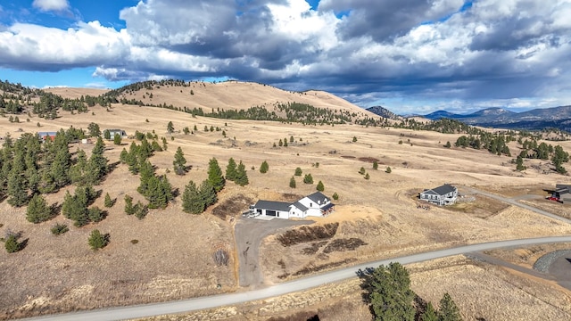 aerial view featuring a mountain view and a rural view