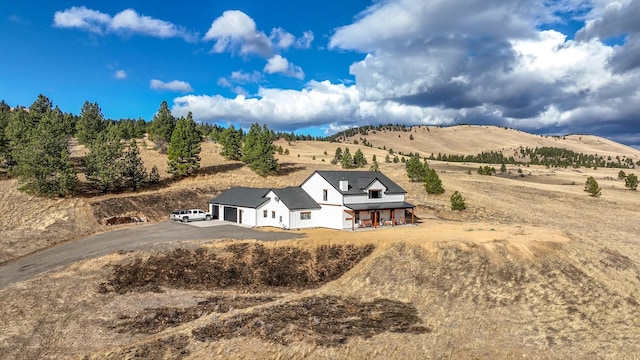 bird's eye view with a mountain view and a rural view