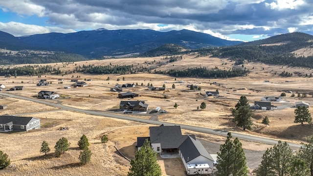 drone / aerial view with a mountain view and a rural view