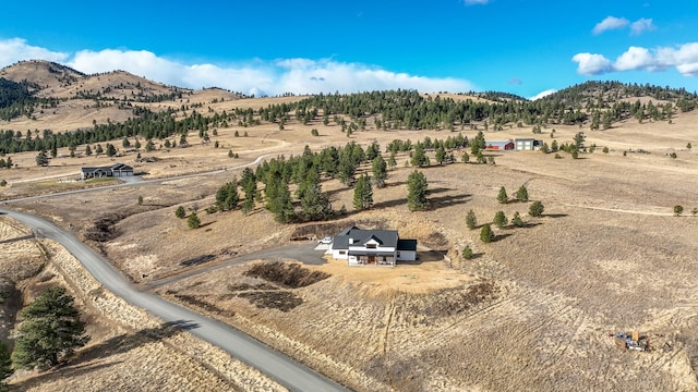 aerial view with a mountain view and a rural view