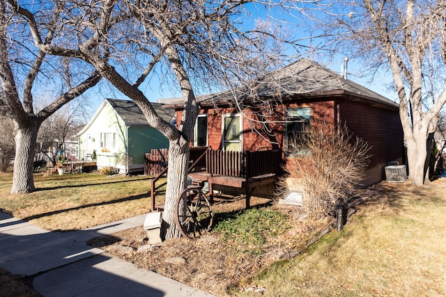 view of front of home with a front lawn and a deck