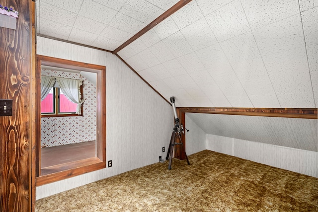 bonus room with carpet floors and lofted ceiling