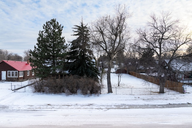 view of yard layered in snow