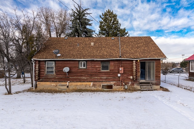 view of snow covered house