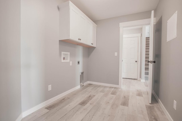 laundry room with cabinets, hookup for an electric dryer, hookup for a washing machine, and light wood-type flooring