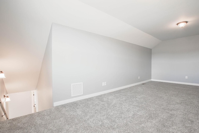 additional living space with lofted ceiling and carpet floors